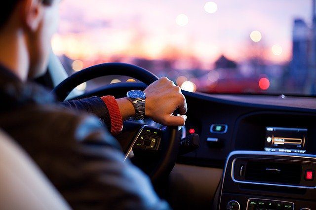 person inside car driving